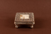 Pure silver MOP chowki with intricate design from Rasava Jewels, showcasing detailed craftsmanship and polished surface.